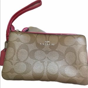 Coach wristlet: pink edge double zipped.